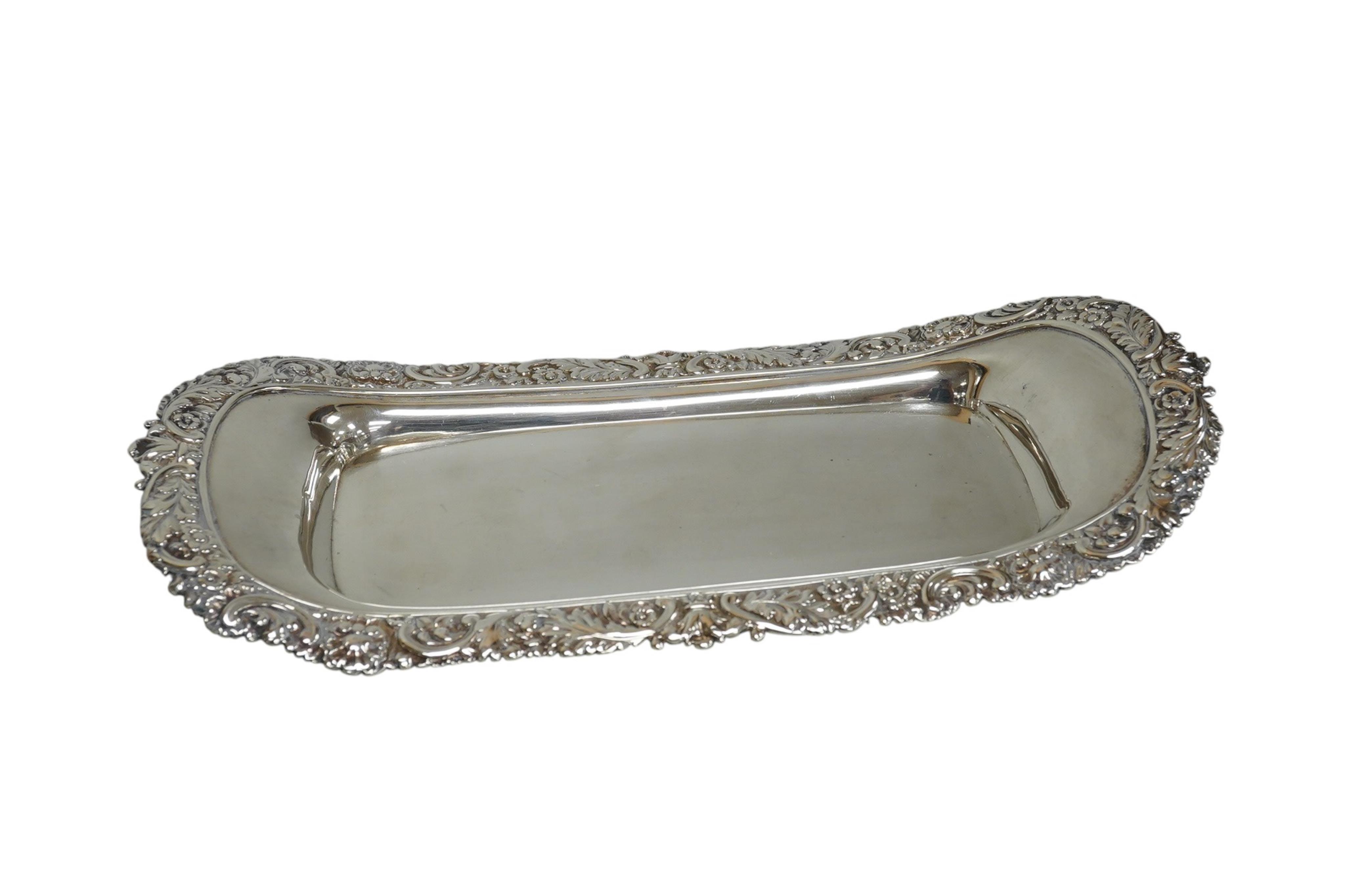 A late George III silver snuffers tray by Eames and Barnard, London, 1817, with foliate border, 26.2cm, 8.5oz.